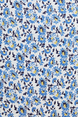 Pattern of blue flowers with yellow centers on a white background