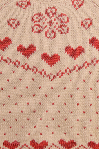 Textile with red heart pattern on beige background