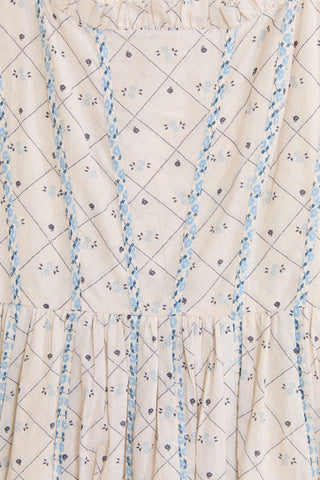 Textured fabric with blue and black pattern on a beige background