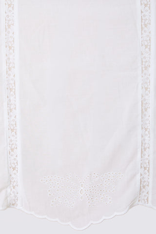 White fabric with decorative trim on a white background