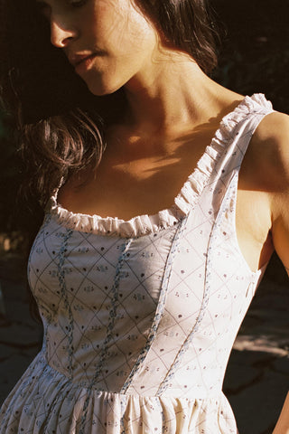 Ruffle square neckline on a light dress