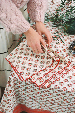 Set of 4 floral block printed napkins on a large table