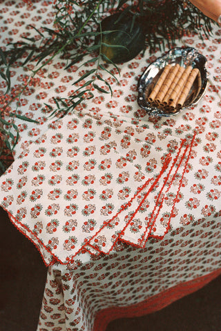 Set of 4 floral block printed napkins on a large table 