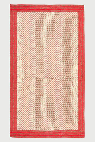 A floral block printed tablecloth zoomed out to show the full border print.