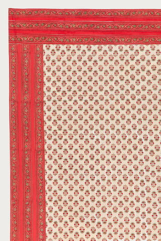 A floral block printed tablecloth zoomed in to show the border print.