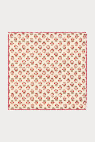 Floral block printed fabric napkin on a white background