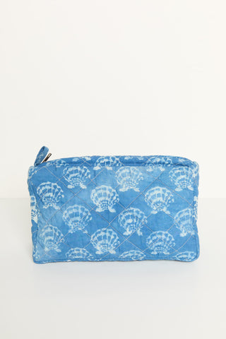 Blue pouch with white shell pattern on a white background