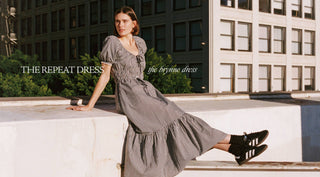 Woman sitting on a ledge wearing Christy Dawn's Brynne Dress with the headline 'The Repeat Dress'
