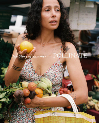 Woman holding fruits and vegetables with 'The Story of Summer - Pollinate' text overlay