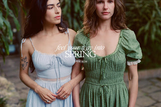 Two women wearing spring dresses with promotional text overlay, feel your way into Spring, shop now