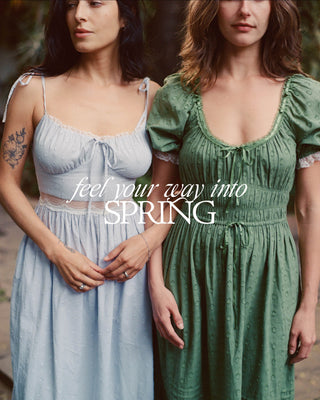 Two women wearing spring dresses with promotional text overlay, feel your way into Spring, shop now