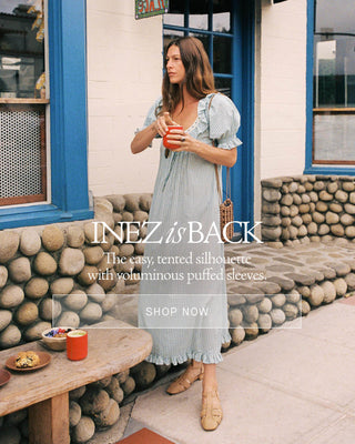 Image of a woman in a blue dress with copy Inez Is Back The easy, tented silhouette with voluminous puffed sleeves.
Shop Now