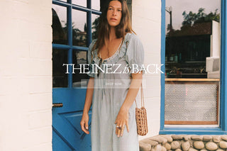 Image of a woman in a blue dress with copy The Inez Is Back Shop Now