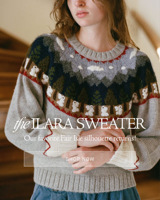 Woman on stairs with copy saying the ilara sweater our favorite fair isle silhouette returns Shop Now