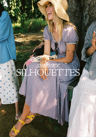 Woman in a patterned dress sitting outdoors with 'summer silhouettes' text overlay.