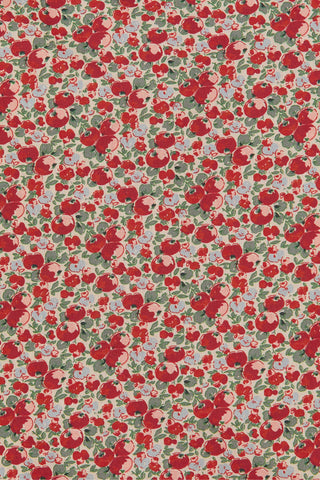 A close-up of a repeating pattern featuring red flowers, apples, and green leaves on a light beige background.
