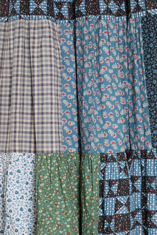 Collection of patchwork fabrics with various patterns and colors.