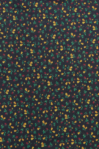 Patterned fabric with small colorful flowers on a dark background