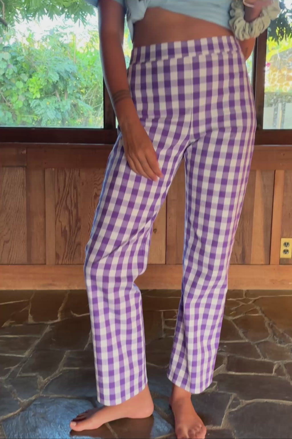 Video of a person wearing purple gingham pants with a close up of the pattern